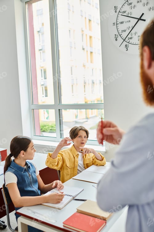 Preview: Diverse minds engaged: classroom scene with teacher and students at desks
