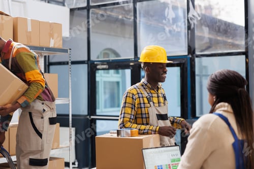 Preview: Warehouse workers checking pick ticket, preparing parcel for shipping
