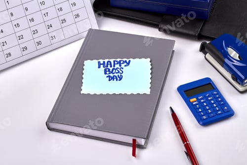 Preview: Happy boss day greeting on the book on white background.