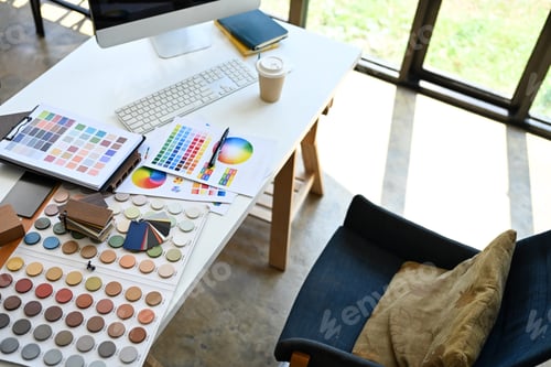 Preview: Above view of Interior designer working table with material sample and color palette