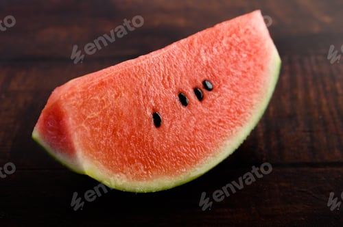 Preview: Sliced watermelon on a wooden table.