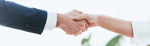 Preview: selective focus of woman and man shaking hands at office