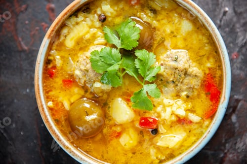 Preview: top view delicious meat soup with potatoes and rice inside plate on dark surface dinner food cuisine