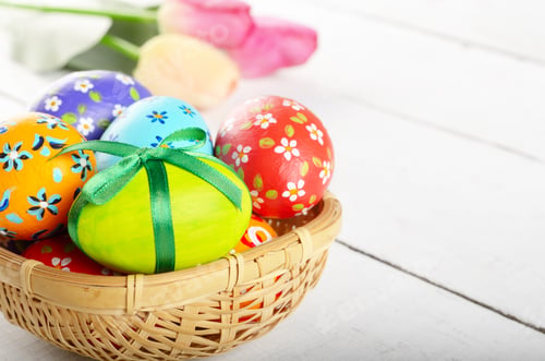 Preview: Rustic style painted easter eggs in basket on white table