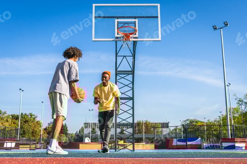 Preview: Multiracial group of young friends bonding outdoors