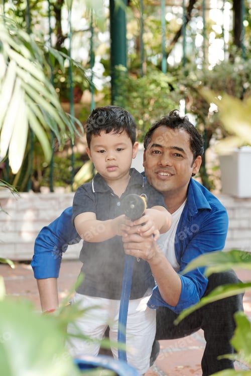 Preview: Father and son spraying water