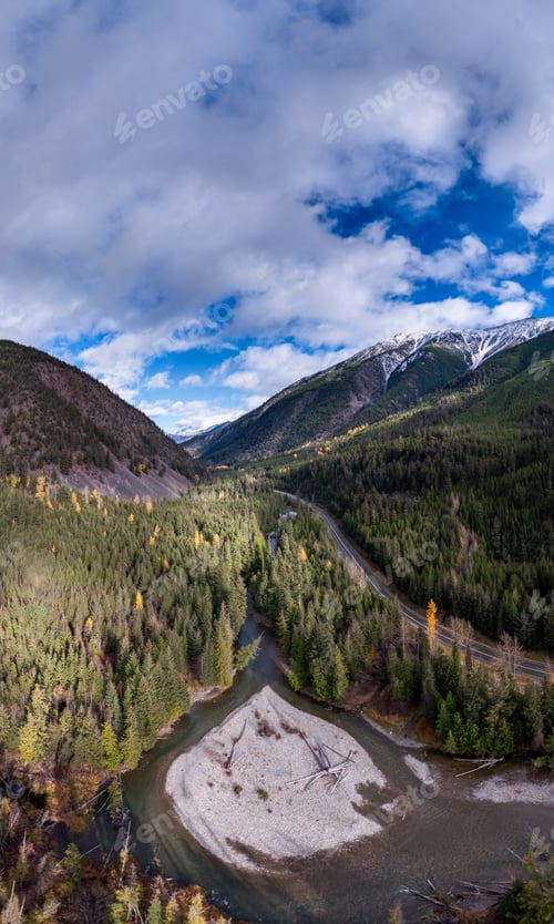 Preview: Aerial View Of Mountain Valley Road And River Through Dense Forest In British Columbia, Canada