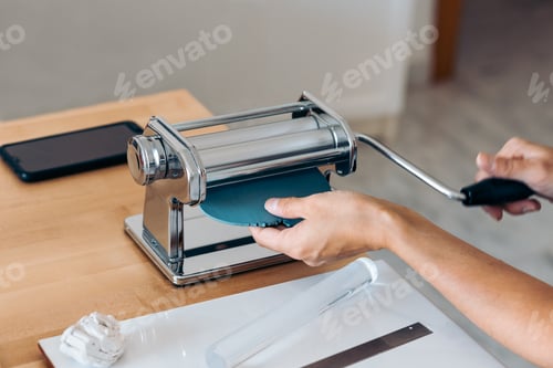 Rolling Blue Polymer Clay Through a Machine