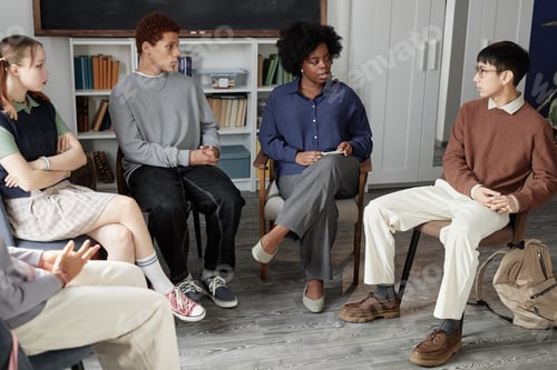 Preview: Therapist Talking to Teen Children Circle in Support Group Meeting