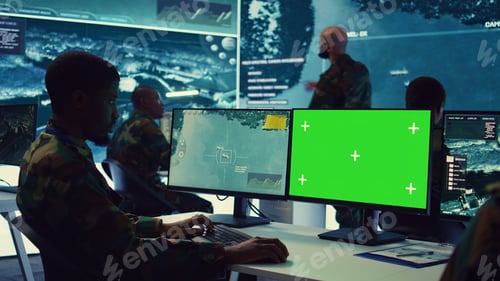 Preview: Intelligence analyst reviews ships activity next to an isolated mockup screen