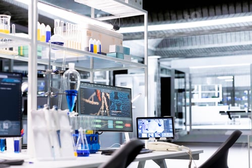 Preview: Research facility workstation with monitor and tablet displaying DNA data