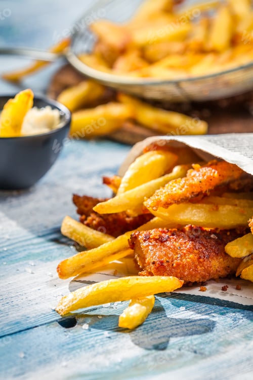 Preview: Closeup of Fish & Chips served in the newspaper