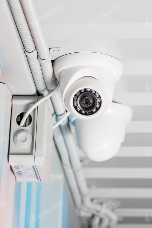 Preview: white security camera on ceiling, home security system concept