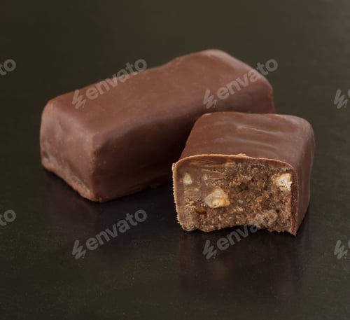 Preview: Sweet chocolate candy isolated on black background