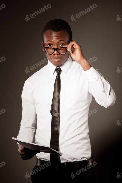 Man in Shirt with Tie Holding Documents