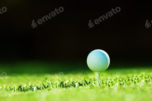 Preview: White golf ball on tee closeup