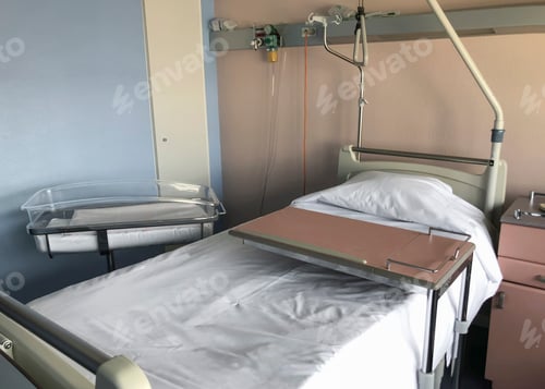 Preview: Empty hospital bed and newborn baby near the bed