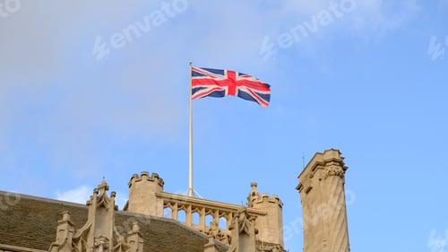 Preview: British national flag waving on building of Parliament of the United Kingdom. The flag of Great Brit