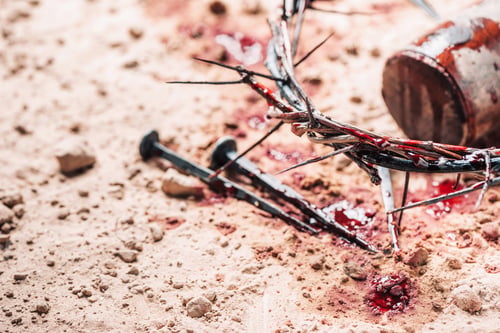 Preview: Old wooden cross, hammer, bloody nails and crown of thorns on ground. Banner. Copy space. Good