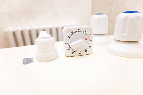Preview: Timer and faucet handles on the bathtub in close-up. Temperature controller for spa treatments.