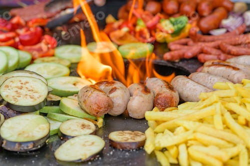 Preview: Fried vegetables with sausages and french fries
