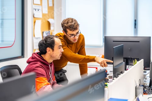 Preview: Engineers working with computer in a cnc modern factory office