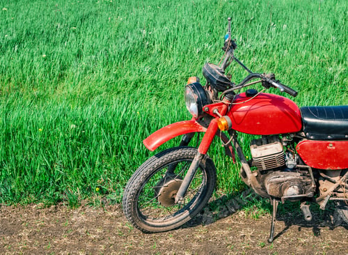 Preview: Classic old motorcycle on a dirt road