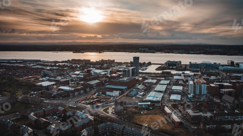 Preview: High angle shot of city buildings with the sea in the background in Liverpool, United Kingdom
