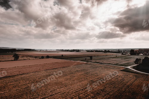 Preview: Empty rural fields in bright sunbeams