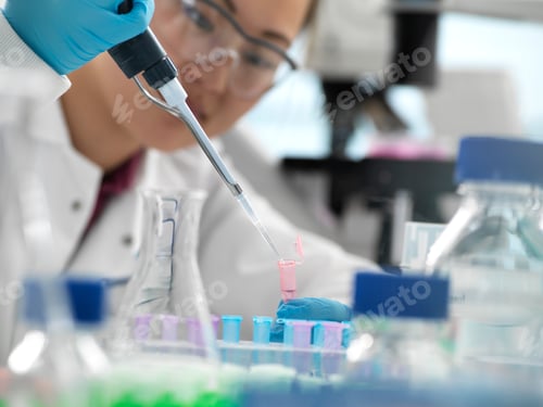 Preview: Scientist pipetting sample into vial during genetic experiment in laboratory