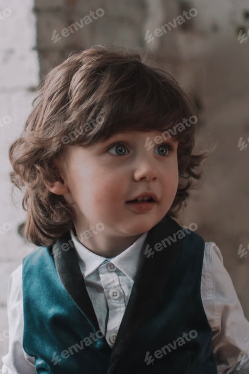 Preview: Portrait of cute curly adorable little boy
