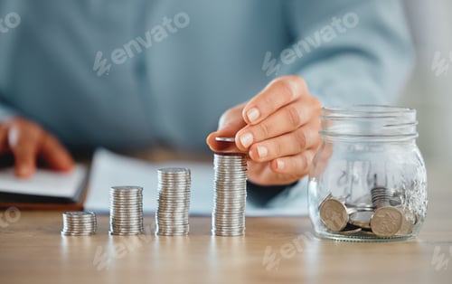 Preview: Growing Savings Stacking Coins in Office Environment