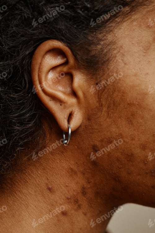 Preview: Young woman with ear piercing and real skin texture