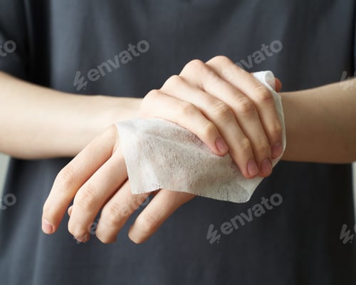 Preview: Woman wash hand wet wipes, to prevent illness Novel coronavirus (2019-nCoV) after public place