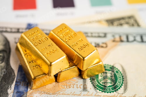 Preview: Gold bar in shopping cart on US dollar banknotes money and graph, economy finance exchange trade