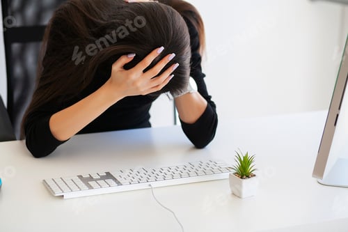 Preview: Pain. Beautiful Businesswoman suffering pain on her office