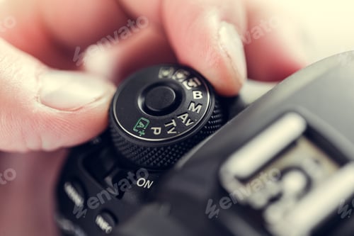 Preview: photographer with camera in hand