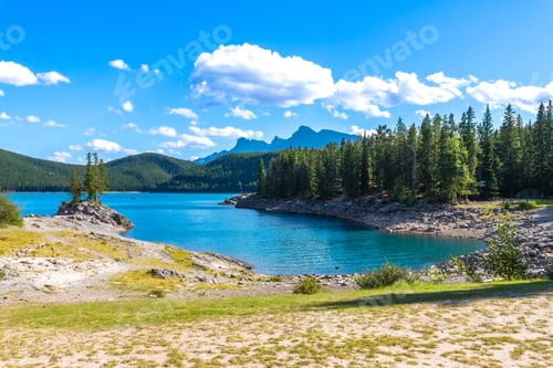 Preview: Lake minnewanka embracing the canadian rockies in banff national park