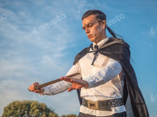 Preview: Brown-haired man with elf ears, carrying a sword in his hands.
