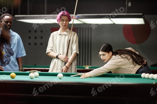 Preview: Friends Playing Billiards in Leisurely Atmosphere