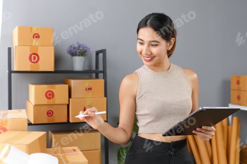 Preview: Young woman managing inventory, checking boxes
