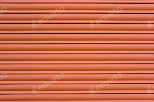 Preview: Red painted roller shutter of a shop