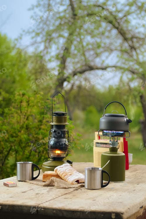 Preview: Making coffee or tea on portable gas stove on the nature.