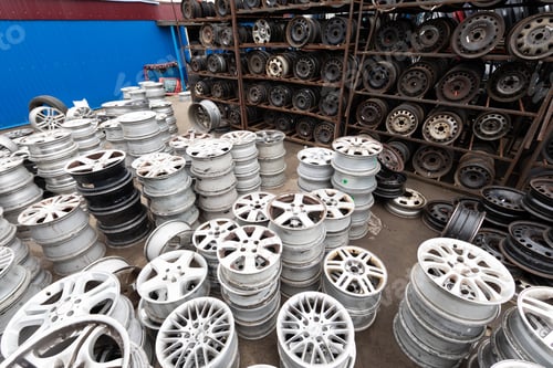 Preview: Auto parts market. Car wheels are on the ground.