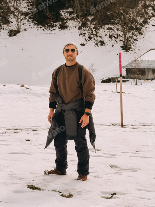 Preview: a man pose in the snow fashion style