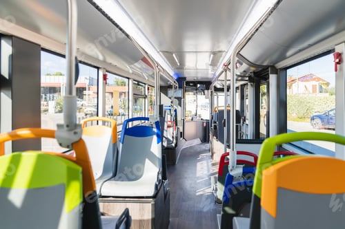Preview: Empty public transport bus interior with colorful seats