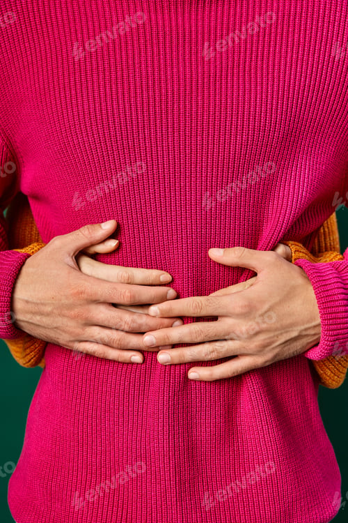 Preview: cropped view of woman hugging boyfriend in pink knitted sweater, hands of loving couple