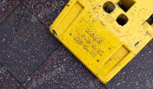 Preview: High angle shot of a yellow construction elements on the ground