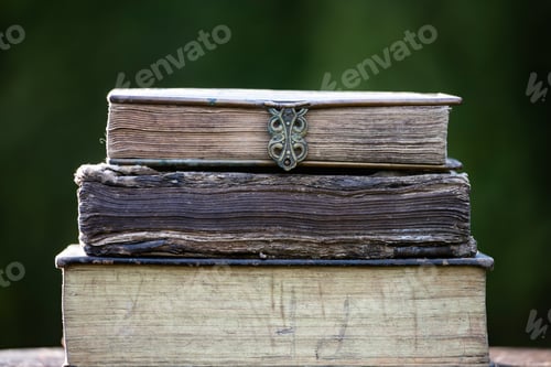 Preview: Collection of old books on dark background