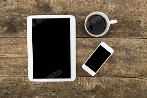 Preview: Digital devices and a cup of coffee on a rustic wooden table in a calm workspace setting
